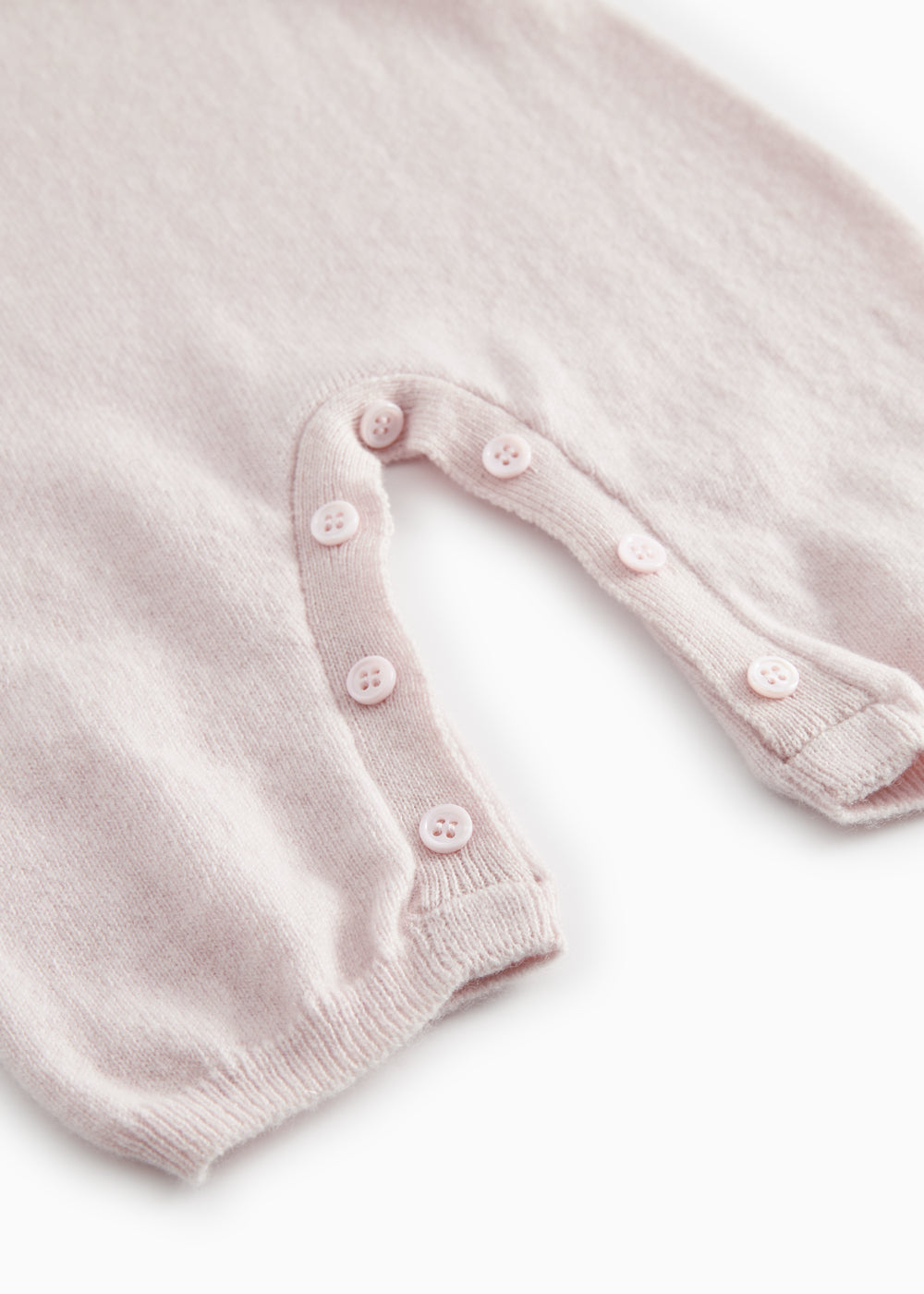 Lyserød melange cashmere heldragt med benåbning og dekorative knapper