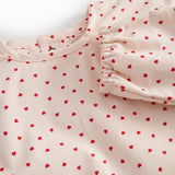 Langærmet spiseforklæde til børn med et fint hjerte print