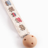 Suttesnor med gummiring, træ/metalklips og togmønster