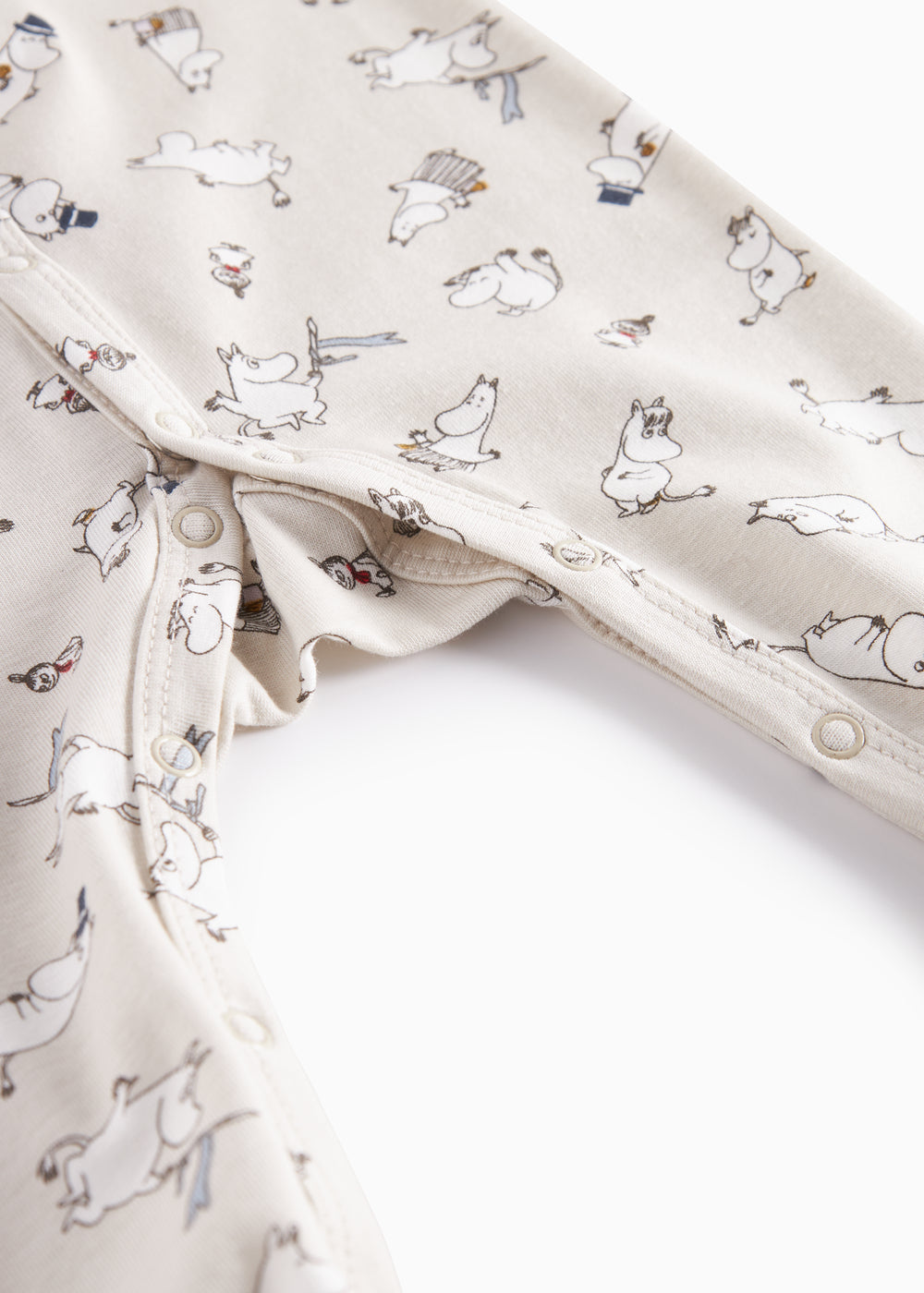 Heldragt til baby med lange ærmer, trykknapper, futter og Moomin-tryk i lyse farver