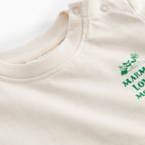 Råhvid T-shirt med grønt Moomin print til baby