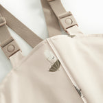 Beige regnbukser med Moomin print og seler til børn