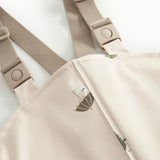 Beige regnbukser med Moomin print og seler til børn