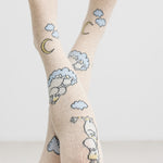 Cremefarvede børnestrømpebukser med Moomin figurer, måne og skyer