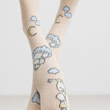 Cremefarvede børnestrømpebukser med Moomin figurer, måne og skyer