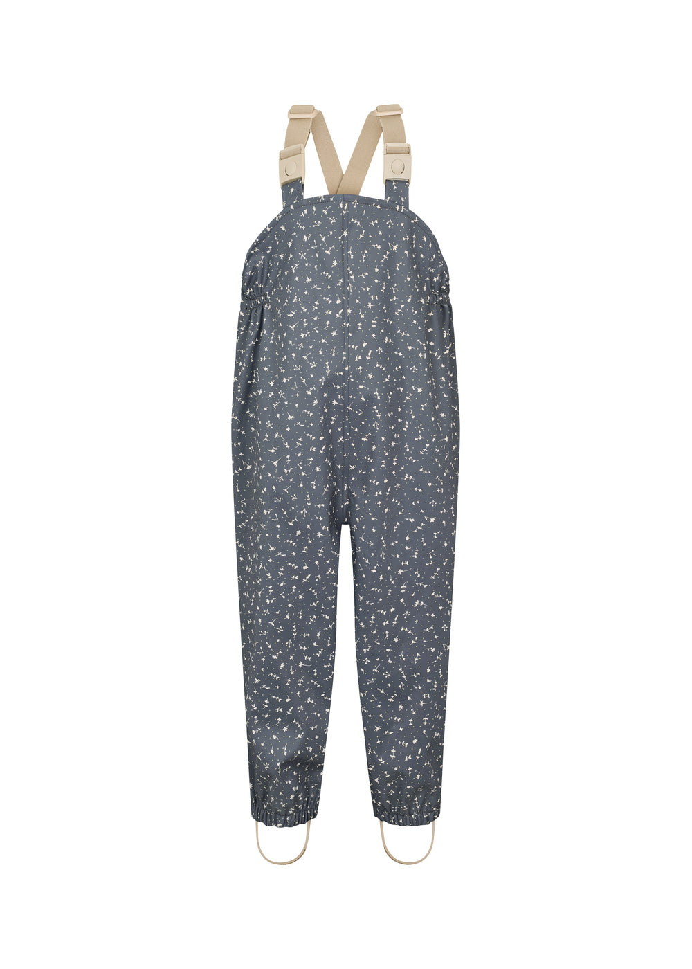 Børne-regnbukser i mørkeblå med små hvide blomster, justerbare seler og fodstropper