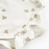 Langærmet bodystocking til nyfødte med slå-om-lukning og fuglmønster