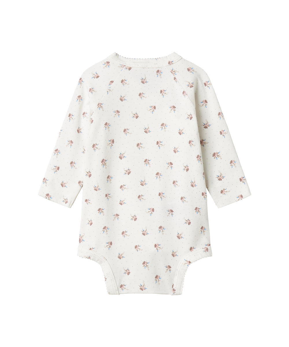 Langærmet bodystocking til nyfødte med slå-om-lukning og blomstermønster