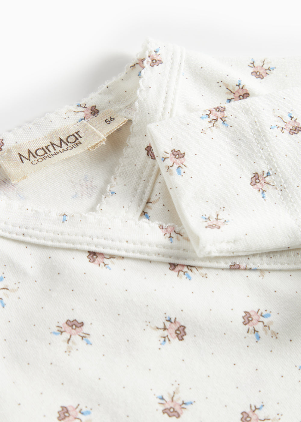 Langærmet bodystocking til nyfødte med slå-om-lukning og blomstermønster