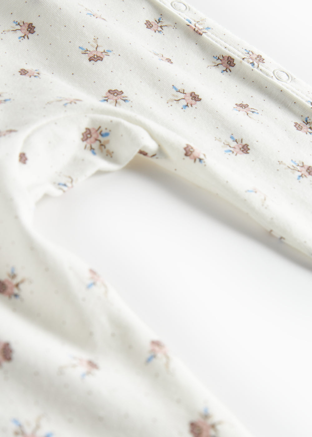 Baby heldragt med blomstermønster