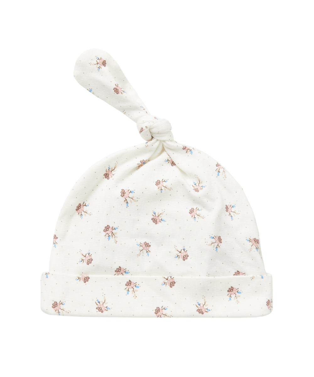 Blød babyhue med mønsterprint og knude på toppen