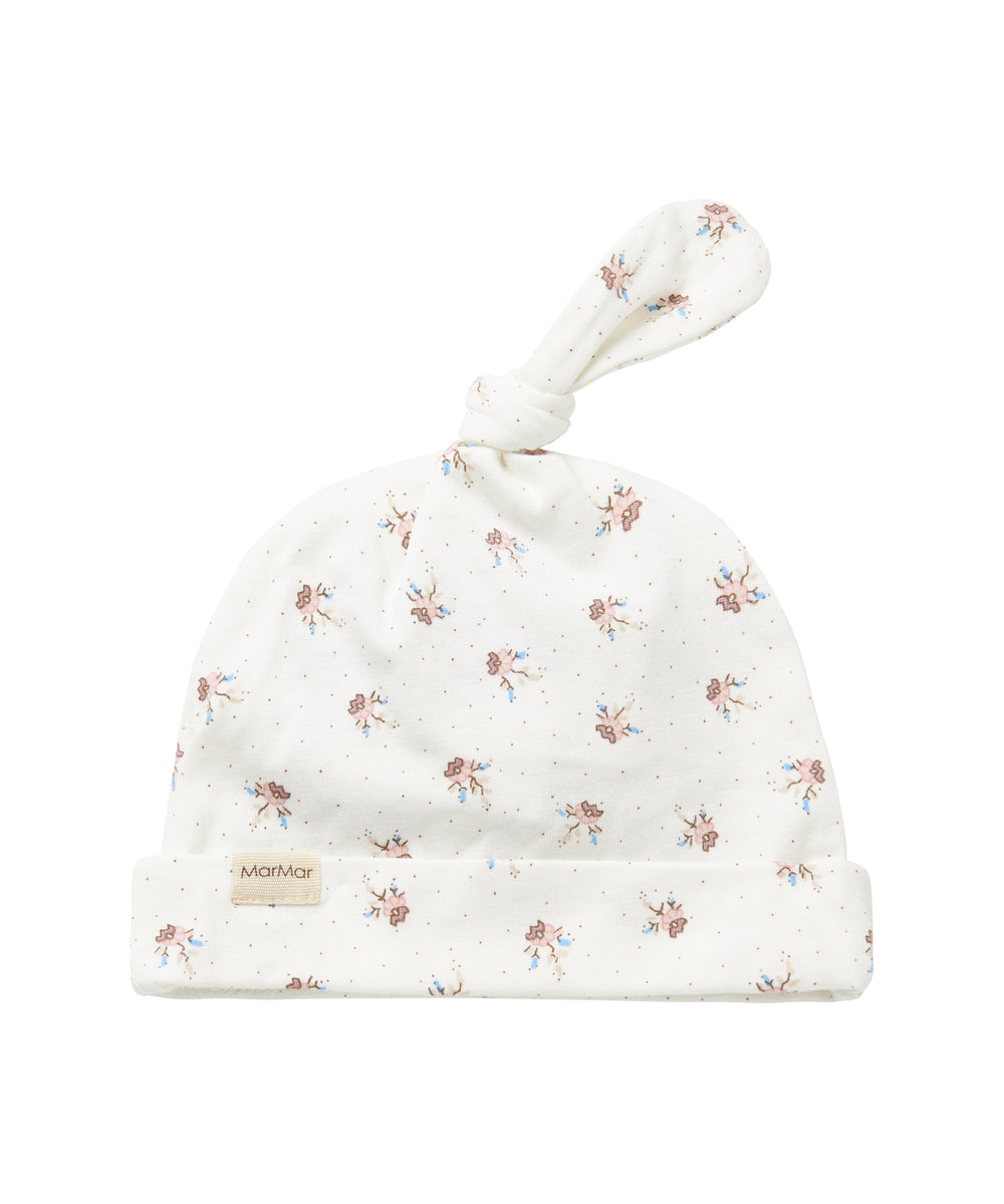 Blød babyhue med mønsterprint og knude på toppen