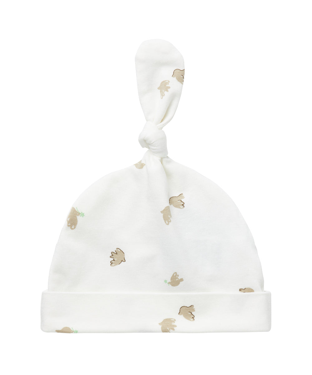 Blød babyhue med mønsterprint og knude på toppen