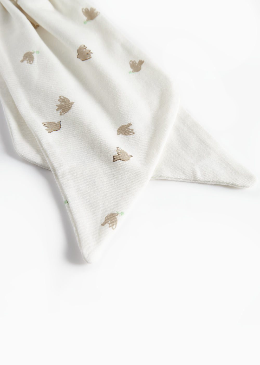 Detaljebillede af blødt stof på bidering med mønster