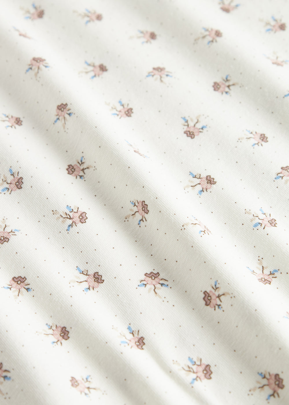 babytæppe med blomstermønster