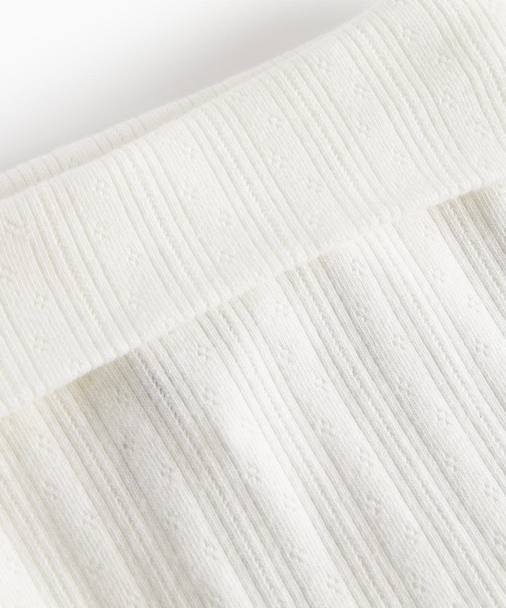 Hvide pointelle bukser med fødder til baby