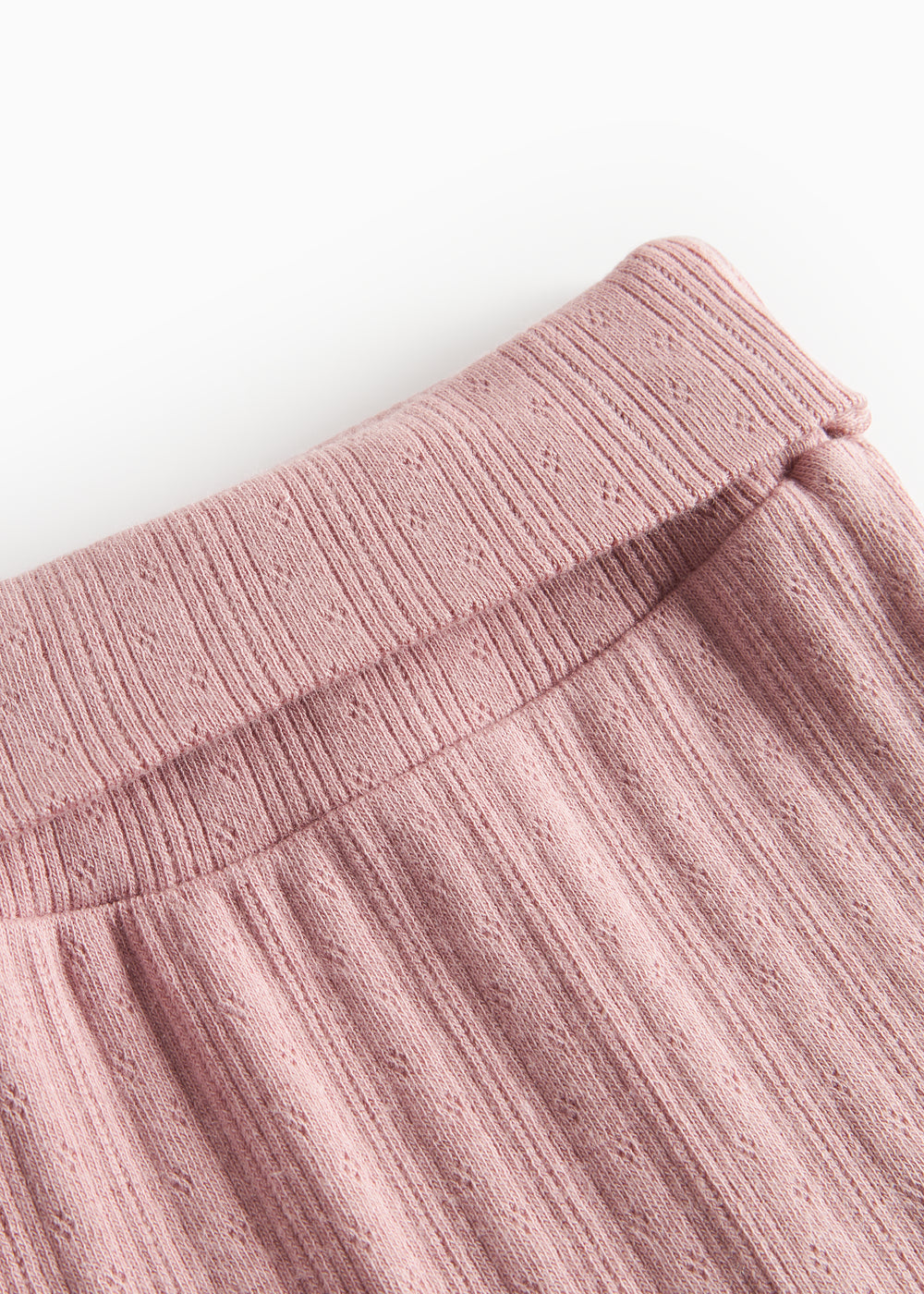 Rosa pointelle bukser til baby med fødder