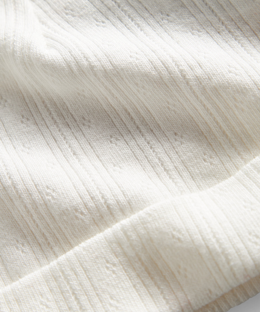 Hvid pointelle hue til baby