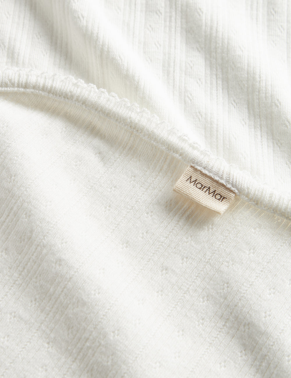 Hvid pointelle babyteppe