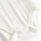 Hvid pointelle body til børn med lange ærmer