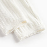 Hvide pointelle bukser til børn med bindebånd og ribkanter