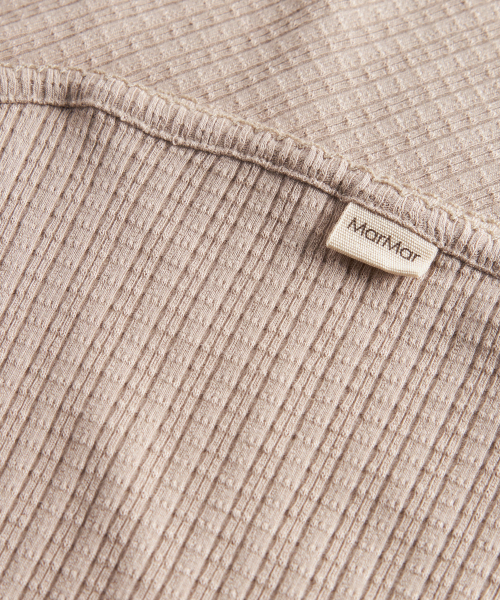 Beige pointelle babytæppe