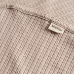 Beige pointelle babytæppe