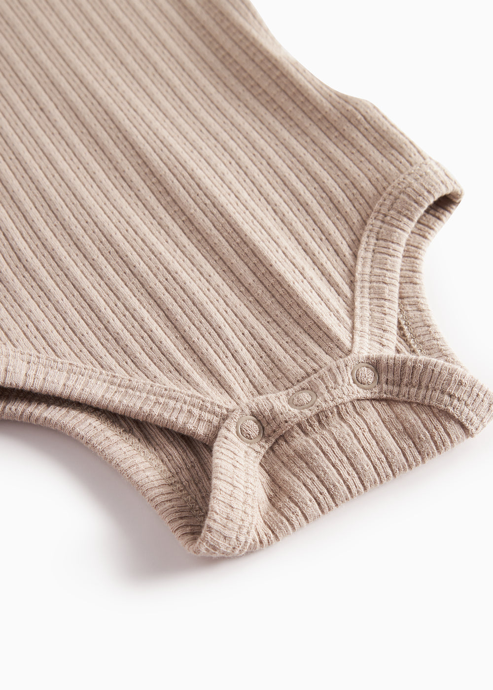 Beige pointelle body med lange ærmer til baby