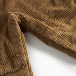 Brun fløjlsoverall til børn med knapper på selerne