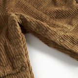 Brun fløjlsoverall til børn med knapper på selerne