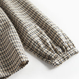 Brun ternet bluse til kvinder med sløjfe i halsen