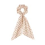 Hårelastik med blomsterprint og bindebånd