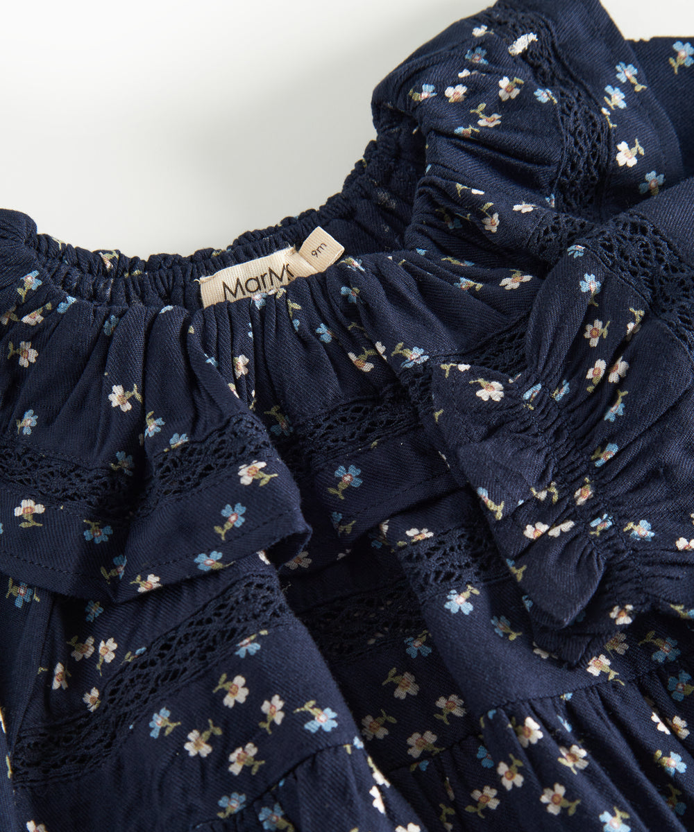 Mørkeblå blomstermønstret heldragt til baby med lange ærmer