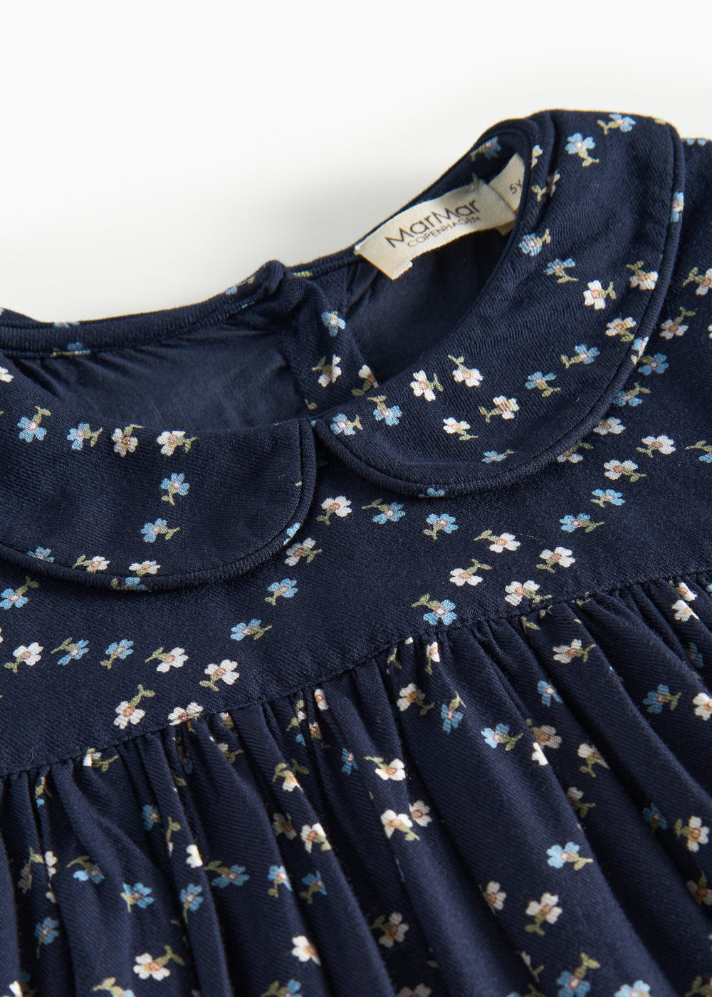 Mørkeblå blomstermønstret kjole til børn med lange ærmer og krave