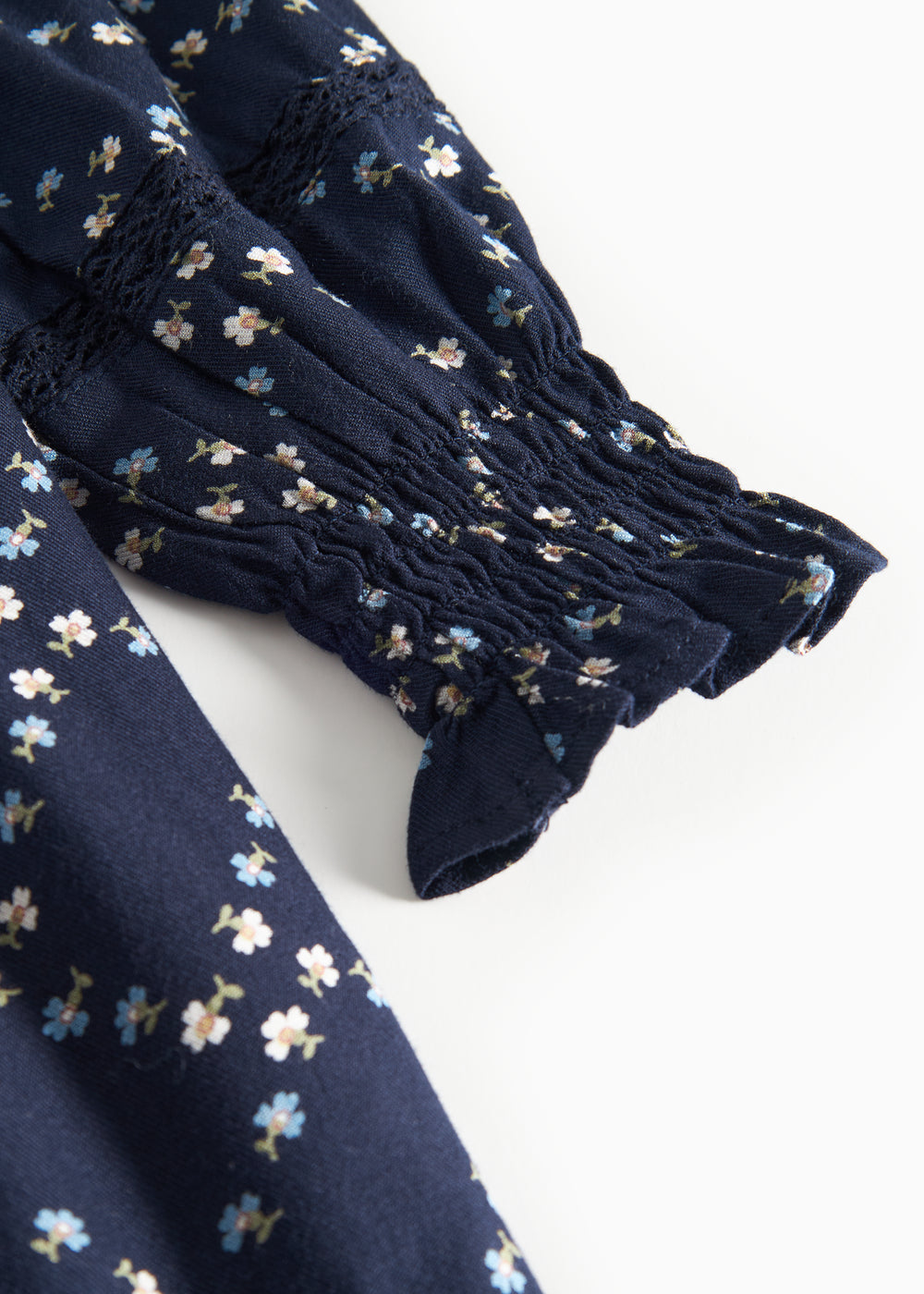 Mørkeblå blomstermønstret kjole til børn med lange ærmer og flser