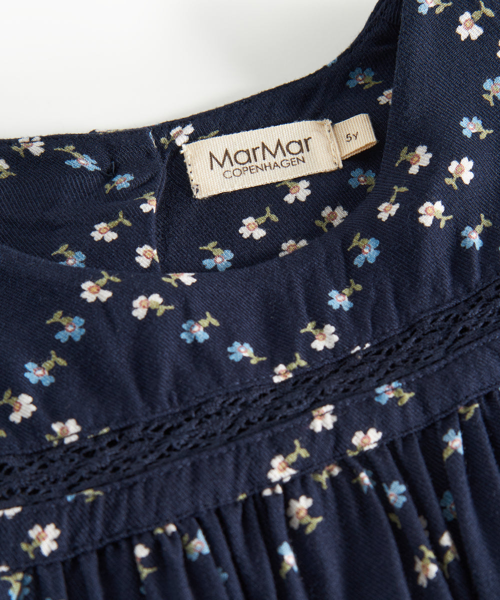 Mørkeblå bluse til børn med blomstermønster og lange ærmer