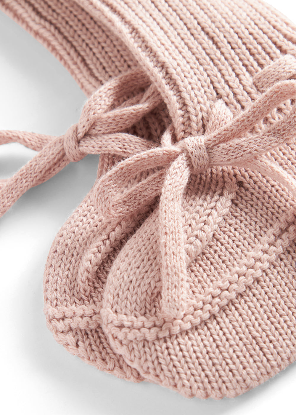 Lyserød strik babyfutter