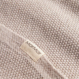Beige strikket babytæppe
