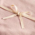 Lyserød strikket babytæppe