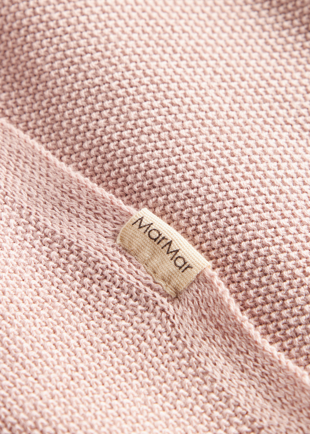 Lyserød strikket babytæppe