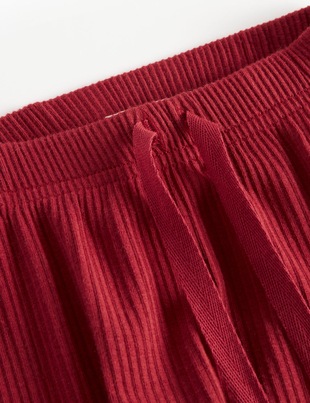 Røde ribbede babybukser med snøre i taljen