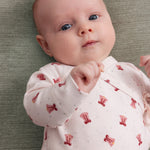 Baby i Slå-om body med rødt juleklokkeprint