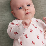 Baby i Slå-om body med rødt juleklokkeprint