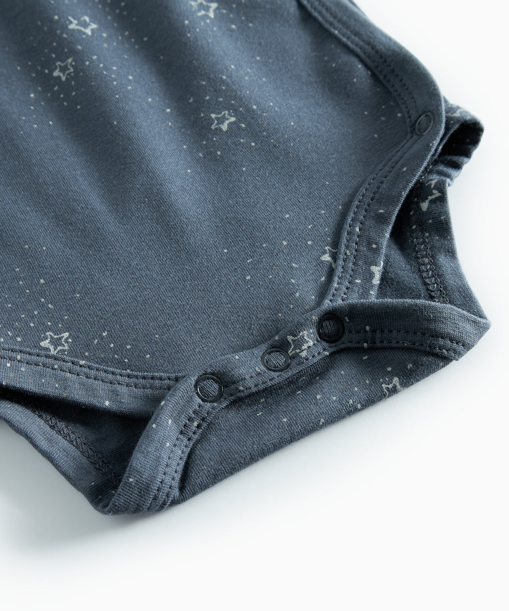Mørkeblå slå-om bodystocking med stjerneprint til baby
