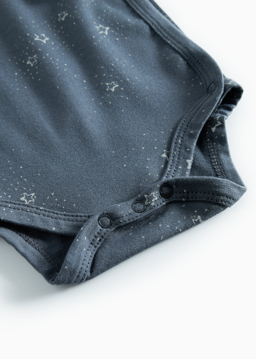 Mørkeblå slå-om bodystocking med stjerneprint til baby