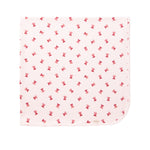 Cremefarvet babytæppe med røde juleklokker