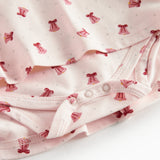 Cremefarvet kjole med røde juleklokker til baby