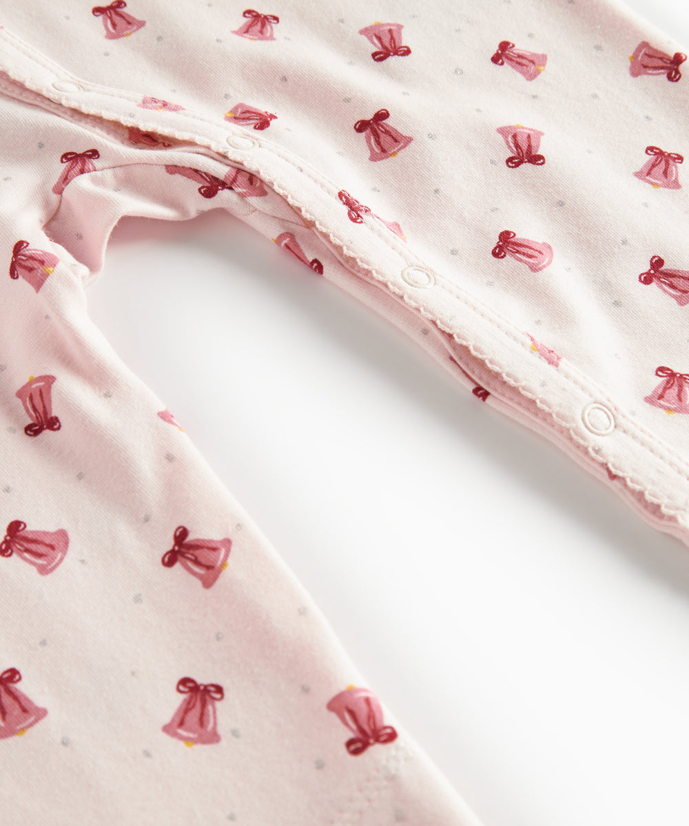 Cremefarvet heldragt med røde juleklokker til baby