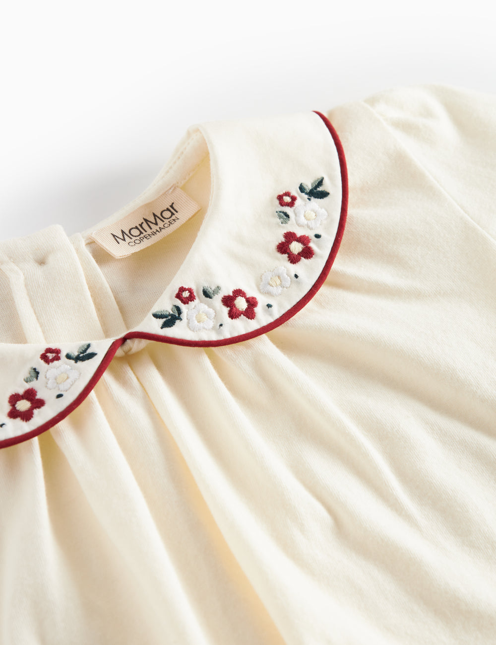 Hvud festbluse med hvid krave og små blomsterbroderier til børn