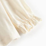 Hvud festbluse med hvid krave og små blomsterbroderier til børn